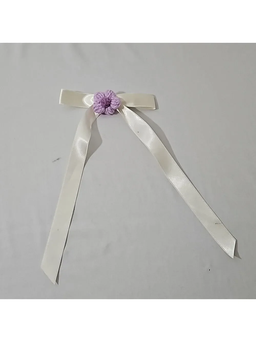 Hand Crafted Ivory Bow with Purple Crochet Flower
